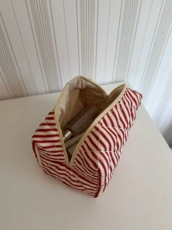 Honey lille toilettaske - Striber i rød/beige
