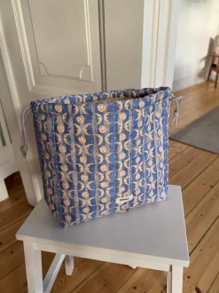 Honey toilettaske med sol og måneprint - Blå/gul