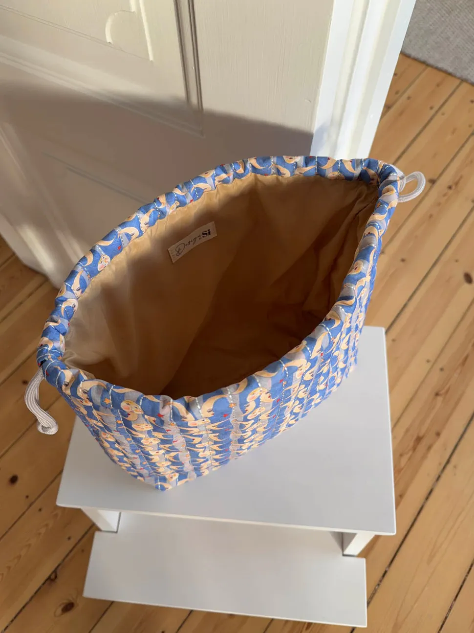 Honey toilettaske med sol og måneprint - Blå/gul